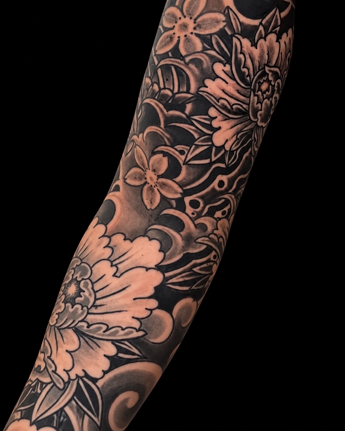 Black and grey Japanese floral sleeve tattoo